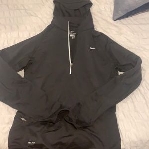Women’s black Nike running 1/4 zip with zip pocket for cellphone or keys!